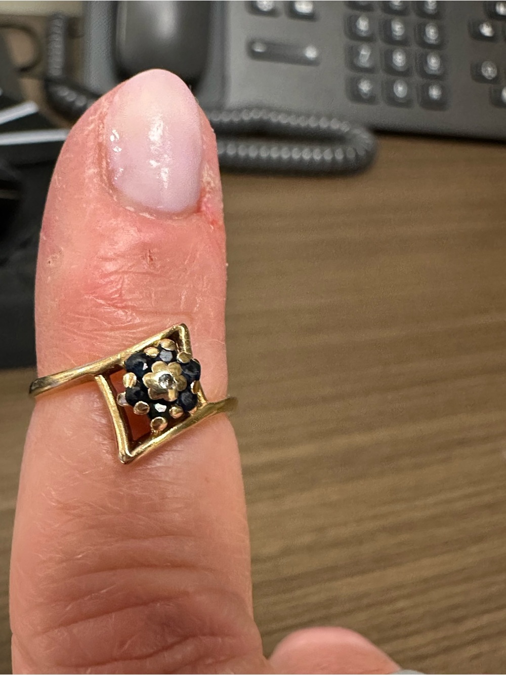 Vintage Gold Floral Accent Ring with dark sapphire